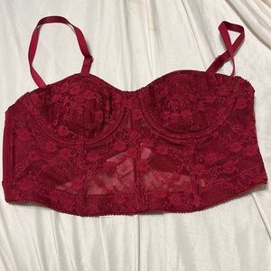 Dark red cropped corset top.